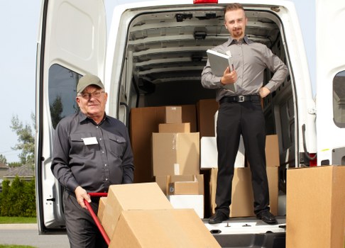 Moving team preparing a home removal in Greenwich with boxes and furniture