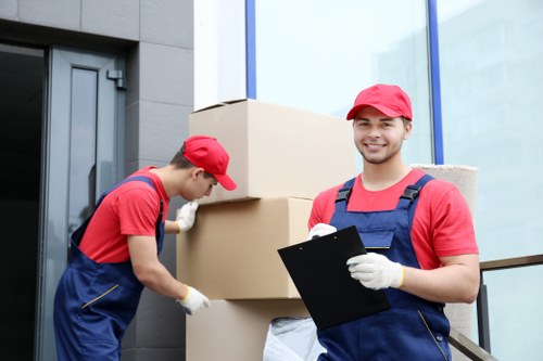 Removal team packing household items for a Greenwich home move