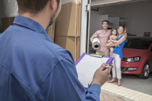 Packing and loading household items into a removal van