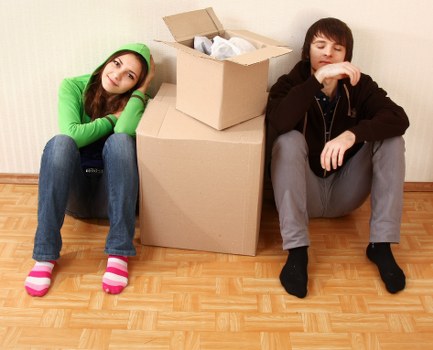 Removal team planning a flat move in Greenwich with boxes and furniture
