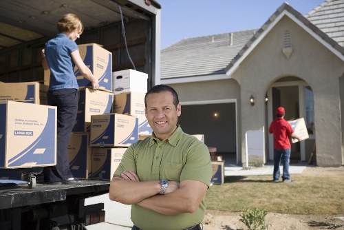 Professional man and van team completing a service