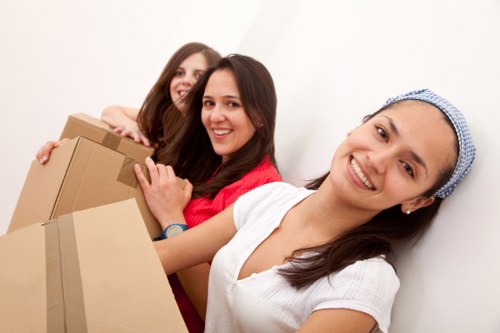 Removal vehicle loading household items for transit