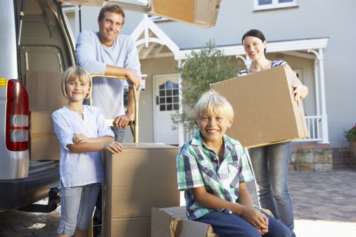 Loading boxes and household items into a van in Greenwich