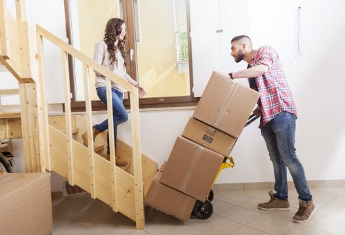 Moving van loading household items for a Greenwich removal