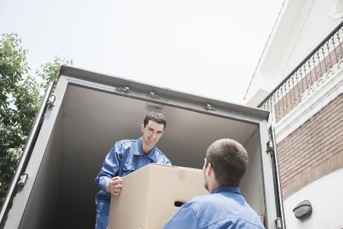 Packed office boxes and furniture ready for removal in Greenwich